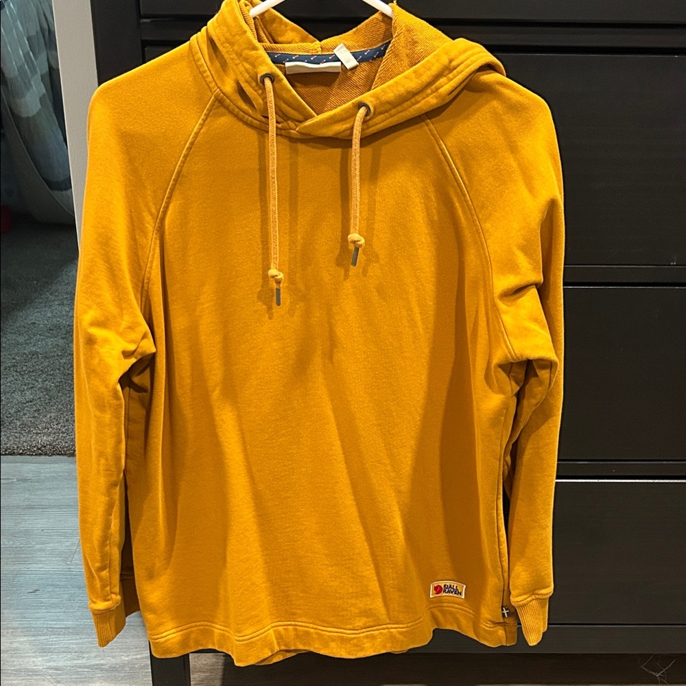 Women’s size medium Fjall Raven hood gold/mustard color